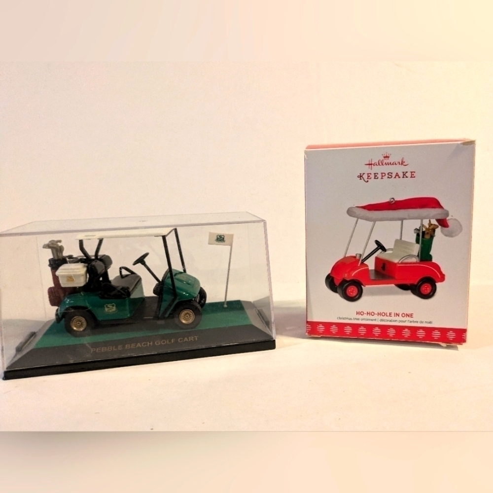 Golf cart ornament Hallmark and Pebble Beach cart in display case.